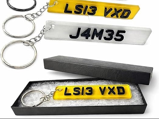 Personalised car number plate keyring with custom name or registration.