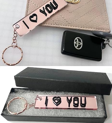 Personalised car number plate keyring with custom name or registration.