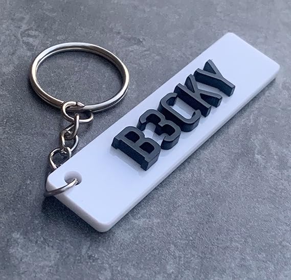 Personalised car number plate keyring with custom name or registration.